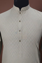 Pistachio green with rust doted self design premium kurta with white shalwar